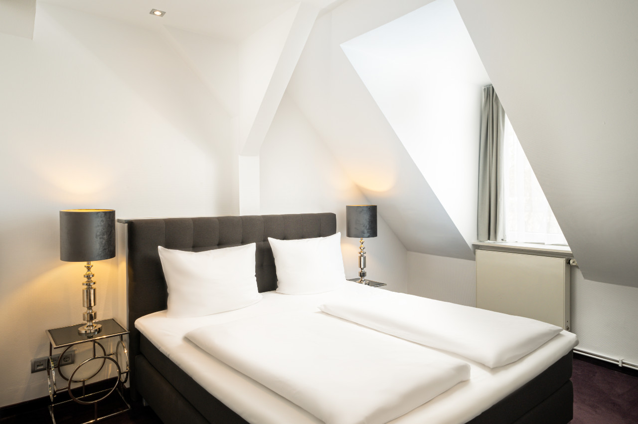 Gemütliches Bett im elaya hotel hannover city